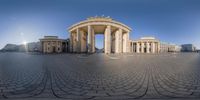 a large building with a very pretty round building with columns in the middle of it