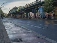 the view under the highway, on a rainy day of the city street and on the streets with buildings and bicycles