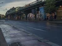 the view under the highway, on a rainy day of the city street and on the streets with buildings and bicycles