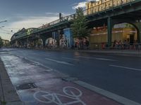 the view under the highway, on a rainy day of the city street and on the streets with buildings and bicycles