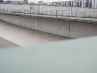 A German City: Concrete Bridge Overlooking a Serene Lake