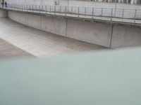 A German City: Concrete Bridge Overlooking a Serene Lake