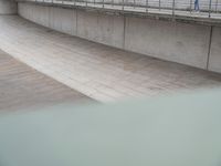 A German City: Concrete Bridge Overlooking a Serene Lake