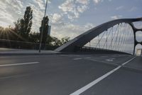 German City at Dawn with Motion Blur on Bridge