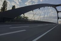 German City at Dawn with Motion Blur on Bridge
