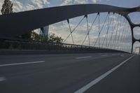 German City at Dawn with Motion Blur on Bridge