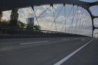German City at Dawn with Motion Blur on Bridge