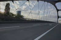 German City at Dawn with Motion Blur on Bridge