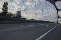 German City at Dawn with Motion Blur on Bridge