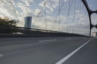 German City at Dawn with Motion Blur on Bridge