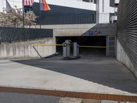 an american flag in the air over a parking garage area for car traffic and pedestrians