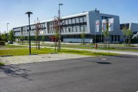 an empty street and an office building in the distance on a clear day in europe