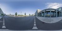 three streets in an office area with an empty road in front of the building at the bottom