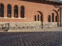 the stone is cobbled in to the street with railings that allow additional support