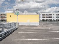 the parking lot with a gate to keep pedestrians out of the way on the street