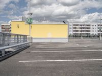 the parking lot with a gate to keep pedestrians out of the way on the street