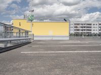 the parking lot with a gate to keep pedestrians out of the way on the street