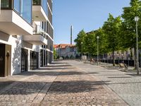 a large building has many windows and doors on both sides of the walkways, which also look very nice