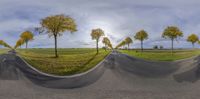 the empty road in the countryside appears to be in an upside down angle with no people