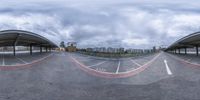 360 view of an empty parking lot with no people inside it with the sky above