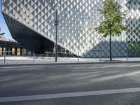 the side of the large building is made up of several different types of metal structures