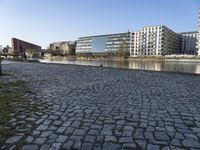 the brick sidewalk is laid to look like the ground of the waterfront area of a city