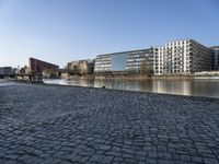 the brick sidewalk is laid to look like the ground of the waterfront area of a city