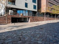 the large building is made of concrete and has metal railings around it, which are made of brick