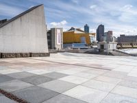 the walkway is empty of any visitors to view the city's buildings and the sidewalk