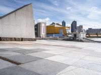 the walkway is empty of any visitors to view the city's buildings and the sidewalk