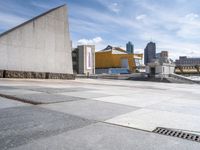 the walkway is empty of any visitors to view the city's buildings and the sidewalk