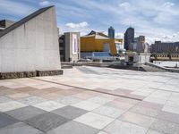 the walkway is empty of any visitors to view the city's buildings and the sidewalk