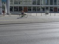 an empty street in front of a store called big b on the corner of a road