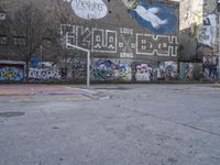 a photo of the wall of some sort with graffiti on it and a red fire hydrant