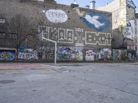 a photo of the wall of some sort with graffiti on it and a red fire hydrant