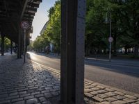 a street that has no traffic sign on it and some trees in the back ground