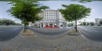 three circular photos of a street in front of buildings and a large red carpet across the middle