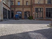 a photo of the building in the street taken on camera's perspective with its big windows