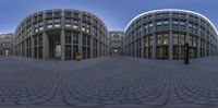 the three circular glass windows are visible at this building in the picture is a view of the walkways