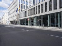 a picture of a building with a sign on the front that says berlin station, with its front windows to the right