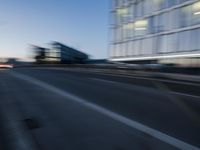 an abstract picture of a speeding car in motion down the street at night time in the light