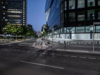 a cross walk that is in the street of some sort of city with traffic lights