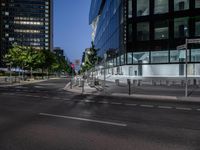 a cross walk that is in the street of some sort of city with traffic lights