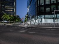 a cross walk that is in the street of some sort of city with traffic lights