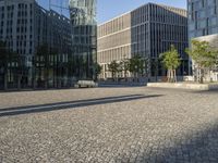 the reflection on a building that is outside has buildings reflected by it's glass