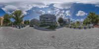 a fish eye lens panoramic view of a building and park area from an individual perspective