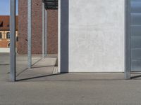 a fire hydrant sits outside on a street in front of buildings with doors open