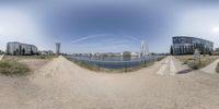 a fish - eye view of the river and town in a city with beach in the background