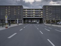 the car park is empty and empty at dusk as a traffic light is set on