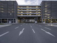 the car park is empty and empty at dusk as a traffic light is set on